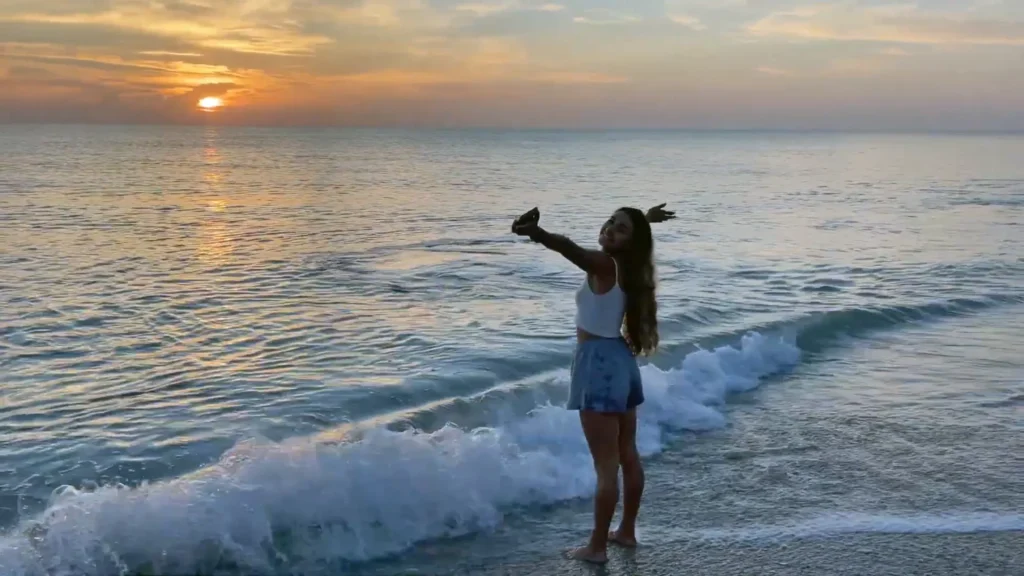 Melanie Breaux at the beach at sunrise