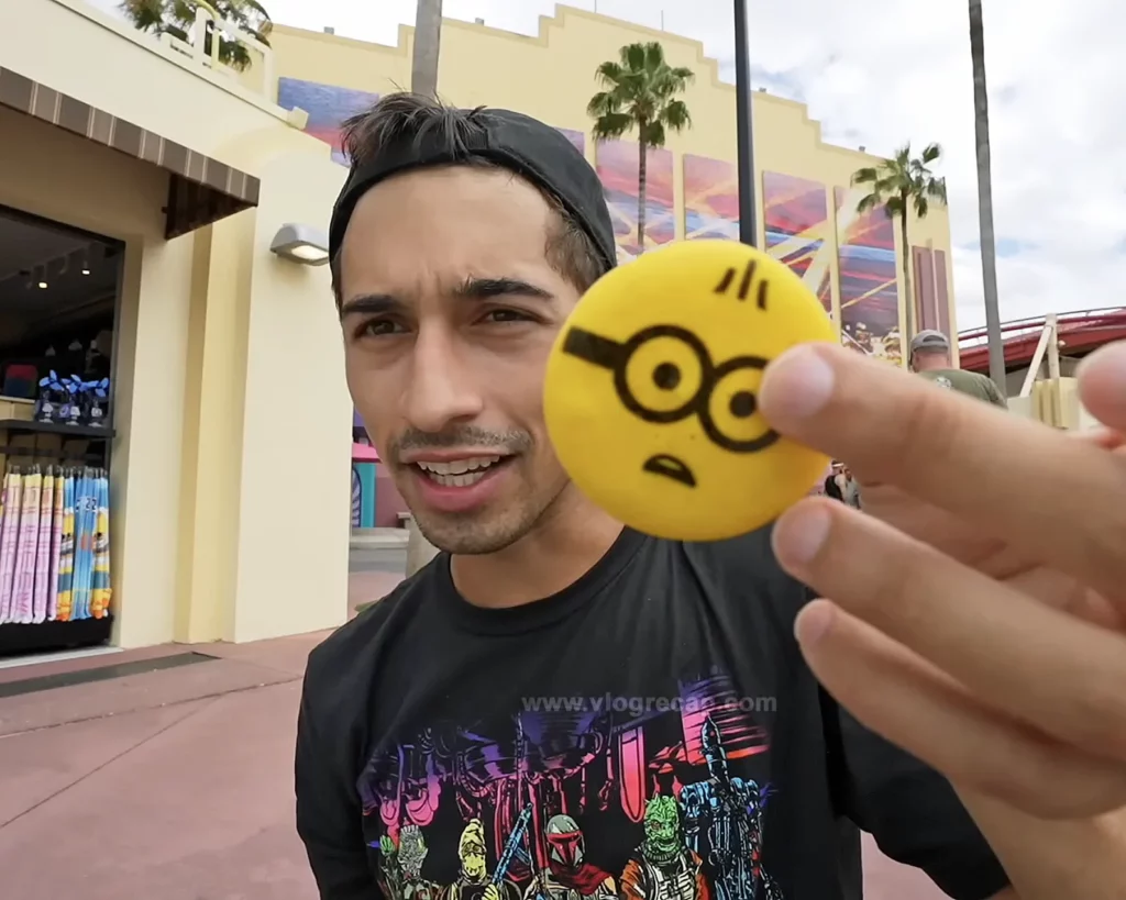 JoJo Crichton in Minion Land holding Minion cookie
