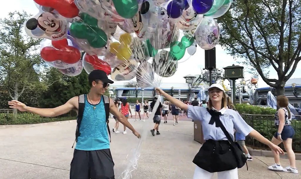 JoJo Crichton dancing with balloon seller