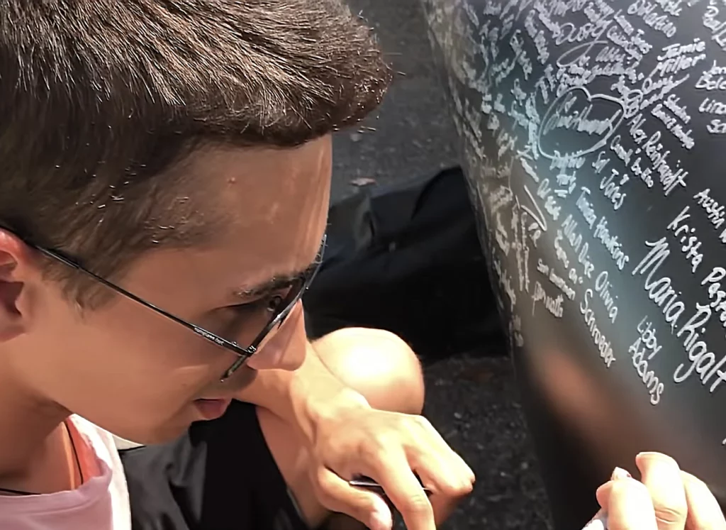 JoJo Crichton signing the new Tron Ride in Magic Kingdom
