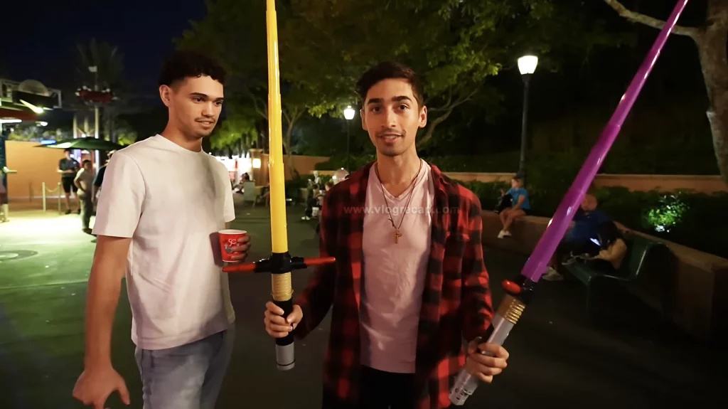 JoJo Crichton giving away a lightsaber to a subscriber of JoJo's World at Disney's Hollywood Studios