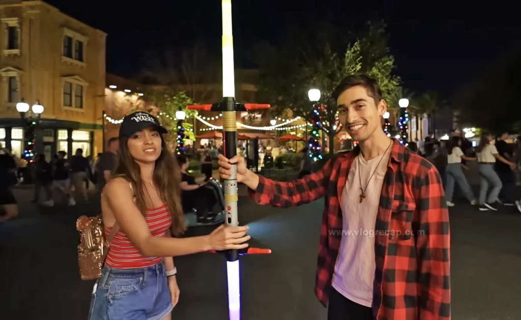 Gabby (Gabriela Vedders) and JoJo Crichton of JoJo's World  holding a lightsaber in Disney's Hollywood Studios