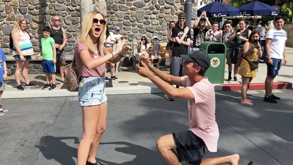 Amanda Wrate accepting a fake engagement ring from JoJo Crichton