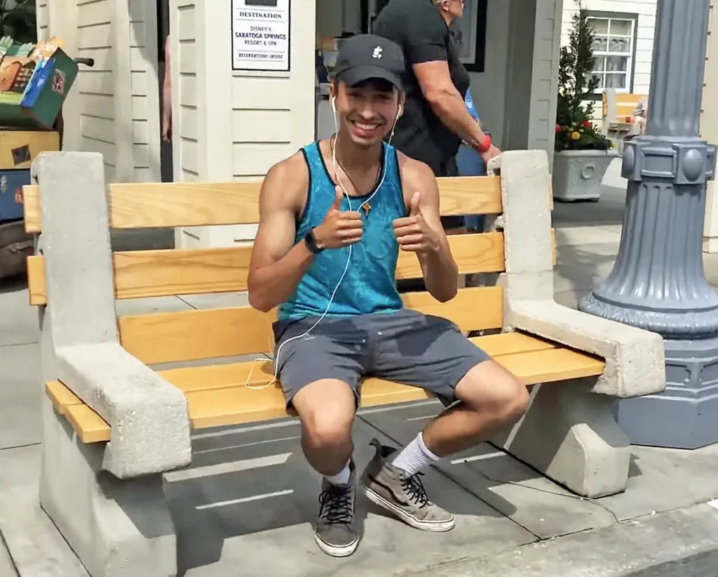 JoJo Crichton sitting on bench on Sunset Boulevard at Disney's Hollywood Studios