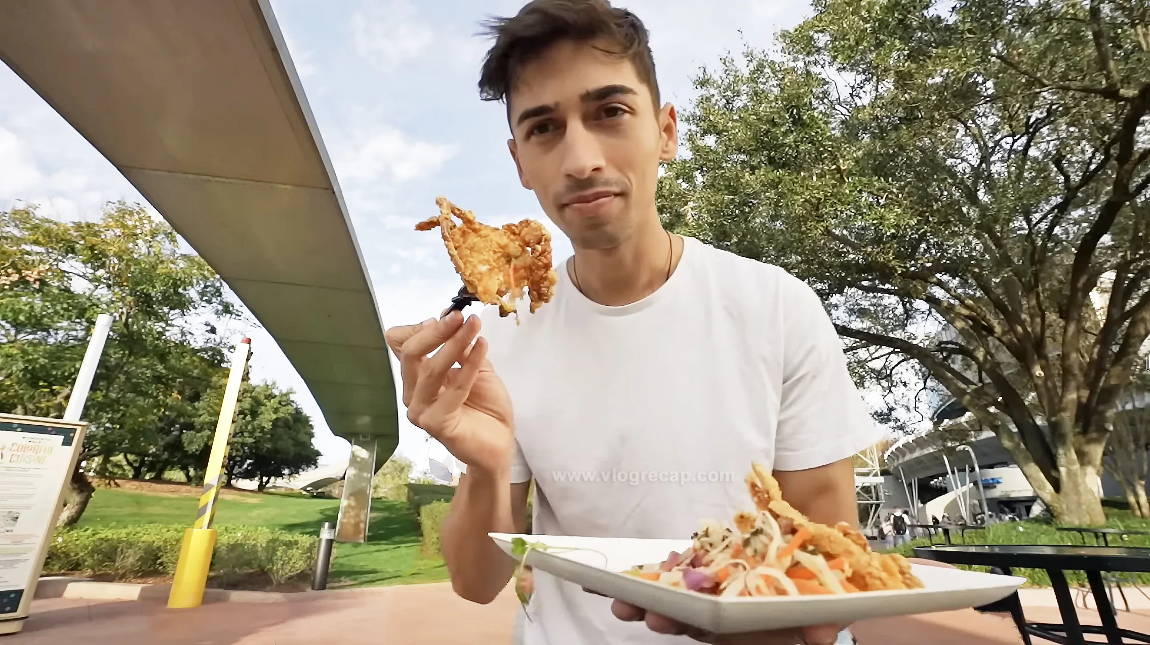 JoJo Crichton eating crab at Epcot during Festival of the Arts