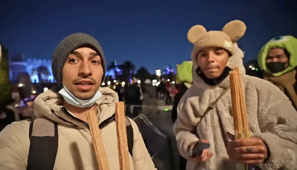 JoJo Crichton and Jete eating Disney churros at Tokyo DisneySea