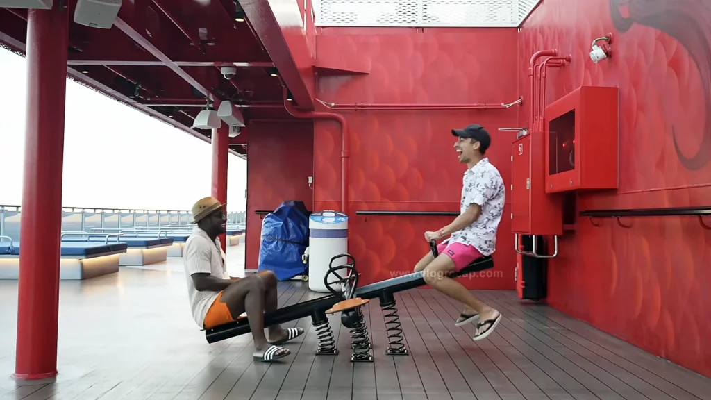 Shiplife J and JoJo Crichton on seesaw on Scarlet Lady