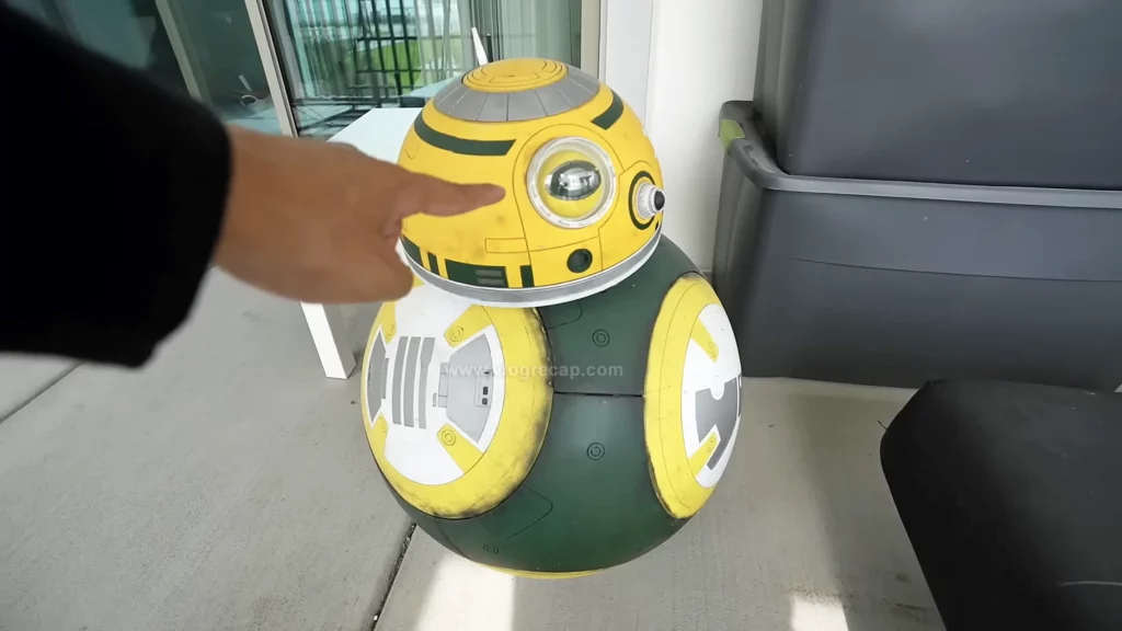 JoJo Crichton with Packers themed BB-8 droid that JoJo fears has a spy camera in it
