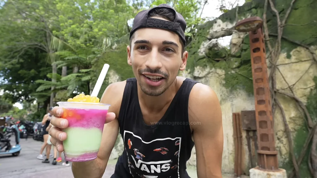 JoJo Crichton drinking a Night Blossom drink from Pongu Pongu in Pandora