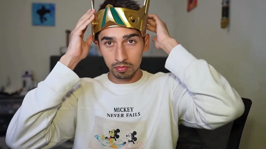 JoJo Crichton livestreaming from his room, wearing a Loki helmet