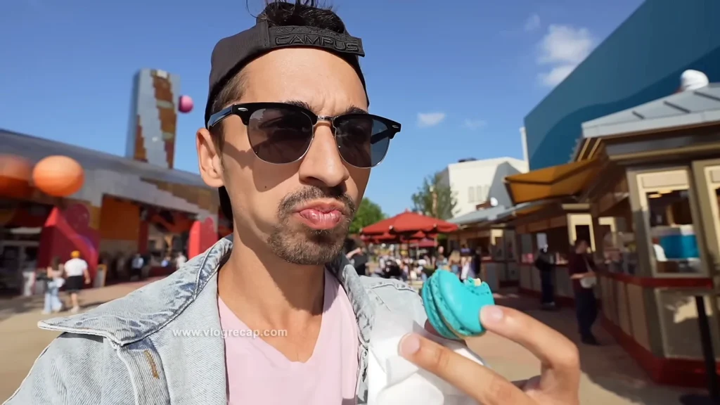 JoJo Crichton eating a macaron at Disney Village at Disneyland Paris
