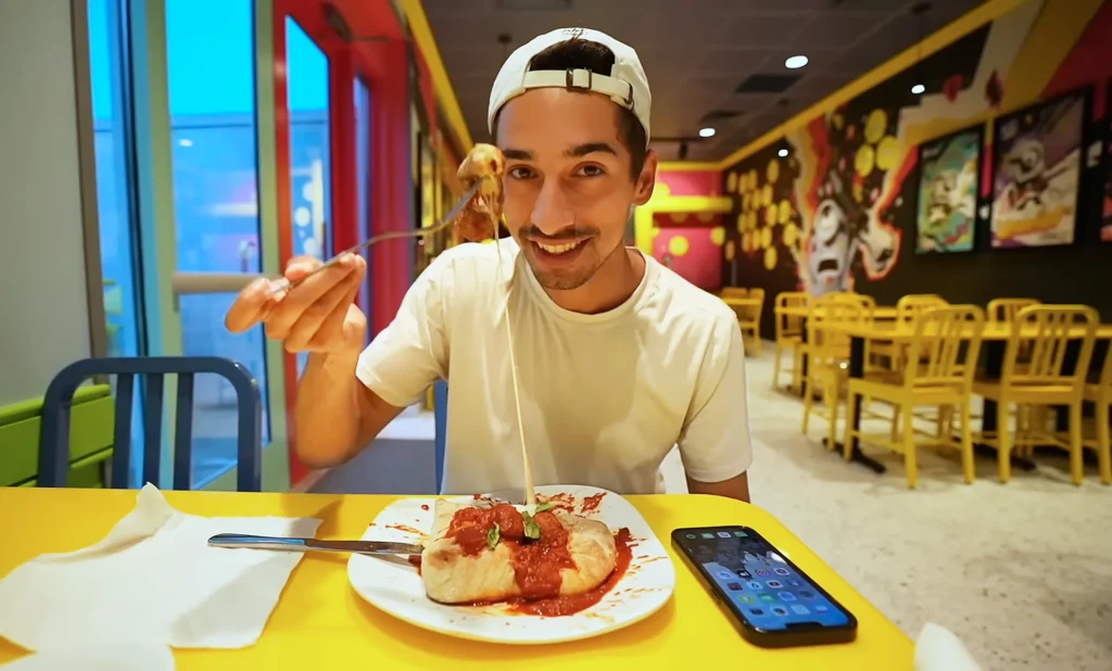 JoJo Crichton eating Mel's Meatball Mountain at Minion Cafe in Universal Studios