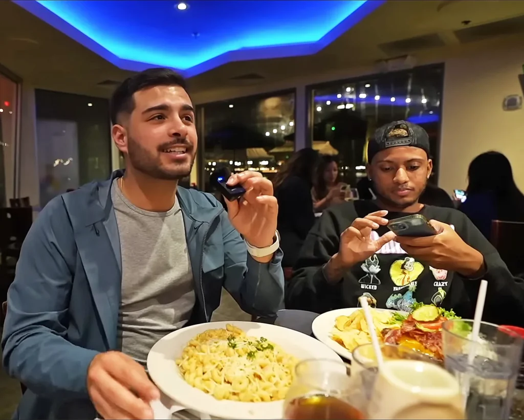 Kevin Mendez and Farris Khan eating at Big River Grille and Brewing Works