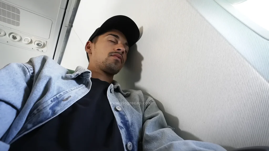 JoJo Crichton sleeping on the plane on flight from Athens, Greece to Paris, France